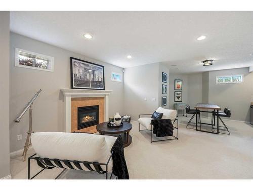 47 Hamptons Close Nw, Calgary, AB - Indoor Photo Showing Living Room With Fireplace