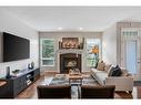 47 Hamptons Close Nw, Calgary, AB  - Indoor Photo Showing Living Room With Fireplace 