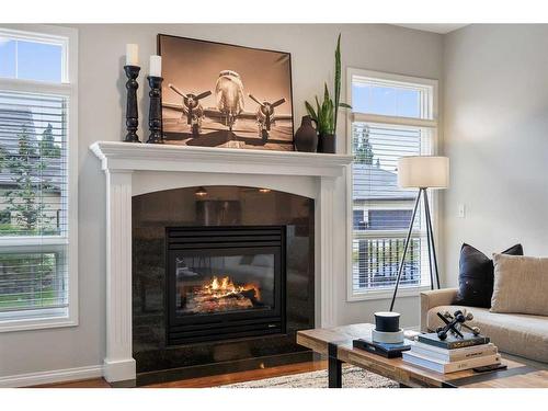 47 Hamptons Close Nw, Calgary, AB - Indoor Photo Showing Living Room With Fireplace