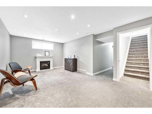 40 Moe Avenue Nw, Langdon, AB - Indoor With Fireplace