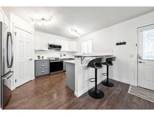 40 Moe Avenue Nw, Langdon, AB - Indoor Photo Showing Kitchen With Stainless Steel Kitchen