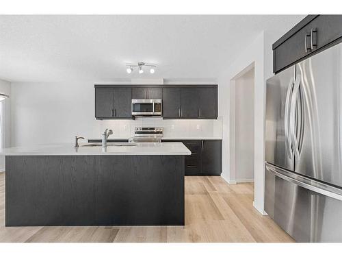 805 Windbury Street Sw, Airdrie, AB - Indoor Photo Showing Kitchen With Stainless Steel Kitchen With Upgraded Kitchen