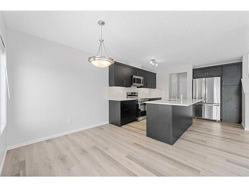 805 Windbury Street Sw, Airdrie, AB - Indoor Photo Showing Kitchen With Stainless Steel Kitchen With Upgraded Kitchen