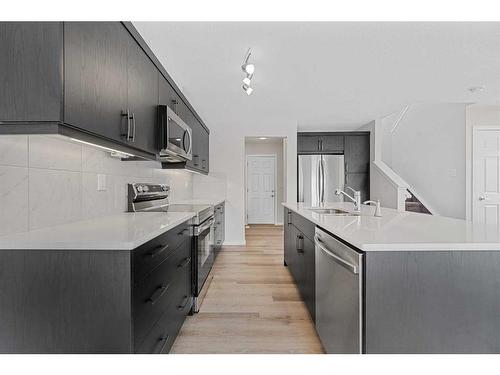 805 Windbury Street Sw, Airdrie, AB - Indoor Photo Showing Kitchen With Stainless Steel Kitchen With Upgraded Kitchen