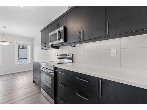 805 Windbury Street Sw, Airdrie, AB - Indoor Photo Showing Kitchen