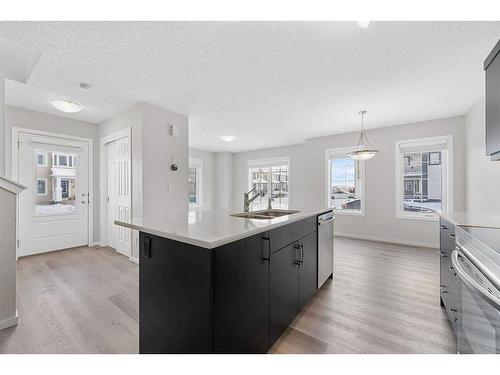 805 Windbury Street Sw, Airdrie, AB - Indoor Photo Showing Kitchen With Double Sink