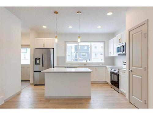 513 Bayview Street Sw, Airdrie, AB - Indoor Photo Showing Kitchen With Double Sink With Upgraded Kitchen