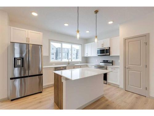 513 Bayview Street Sw, Airdrie, AB - Indoor Photo Showing Kitchen With Upgraded Kitchen