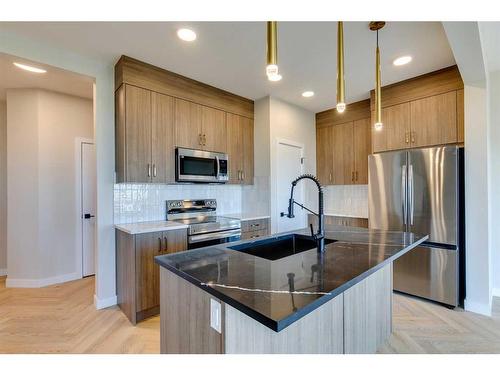 171 Mill Road, Cochrane, AB - Indoor Photo Showing Kitchen With Upgraded Kitchen