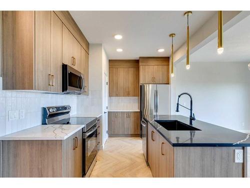 171 Mill Road, Cochrane, AB - Indoor Photo Showing Kitchen With Upgraded Kitchen