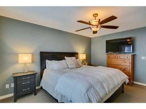 229 Cimarron Drive, Okotoks, AB - Indoor Photo Showing Bedroom