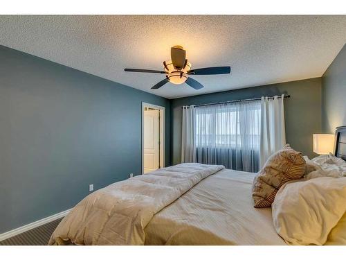 229 Cimarron Drive, Okotoks, AB - Indoor Photo Showing Bedroom