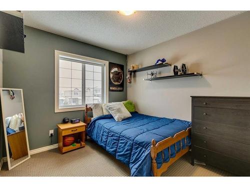 229 Cimarron Drive, Okotoks, AB - Indoor Photo Showing Bedroom