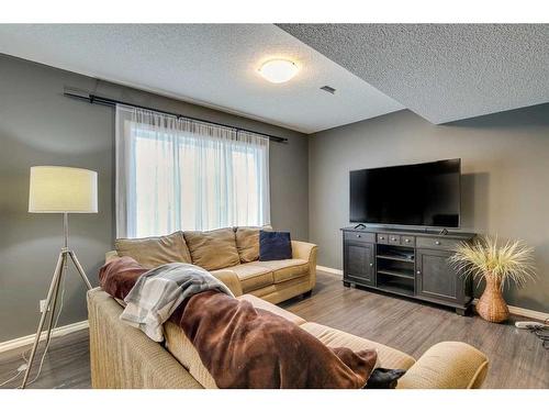 229 Cimarron Drive, Okotoks, AB - Indoor Photo Showing Living Room