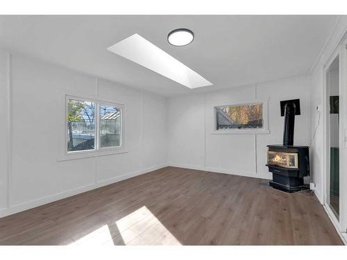 727 Hunterston Road Nw, Calgary, AB - Indoor With Fireplace