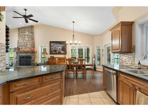 147-5417 Highway 579, Rural Mountain View County, AB - Indoor Photo Showing Kitchen With Fireplace