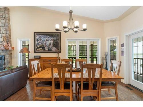 147-5417 Highway 579, Rural Mountain View County, AB - Indoor Photo Showing Dining Room With Fireplace