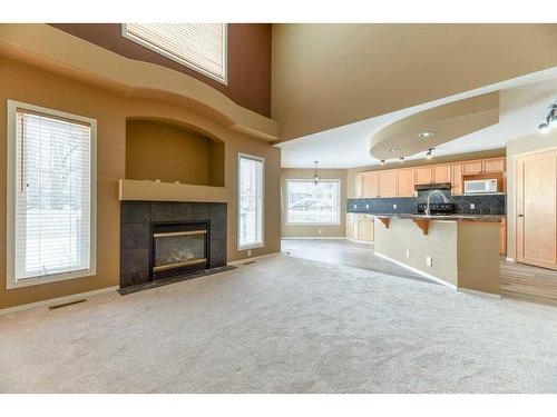 82 Tuscany Ravine Road Nw, Calgary, AB - Indoor Photo Showing Living Room With Fireplace