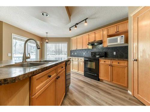 82 Tuscany Ravine Road Nw, Calgary, AB - Indoor Photo Showing Kitchen With Double Sink