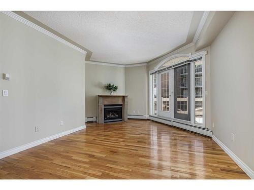 104-1315 12 Avenue Sw, Calgary, AB - Indoor With Fireplace