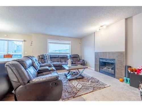 23 Taralake Lane Ne, Calgary, AB - Indoor Photo Showing Living Room With Fireplace