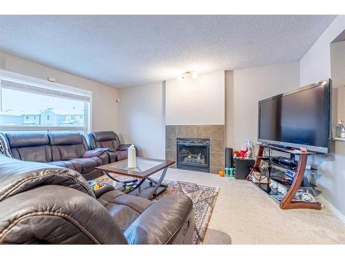 23 Taralake Lane Ne, Calgary, AB - Indoor Photo Showing Living Room With Fireplace