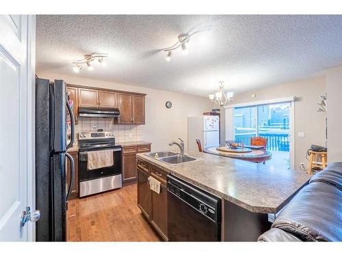 23 Taralake Lane Ne, Calgary, AB - Indoor Photo Showing Kitchen With Double Sink