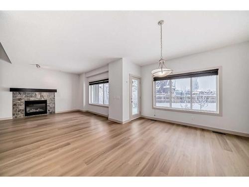 311 Mahogany Court Se, Calgary, AB - Indoor Photo Showing Living Room With Fireplace