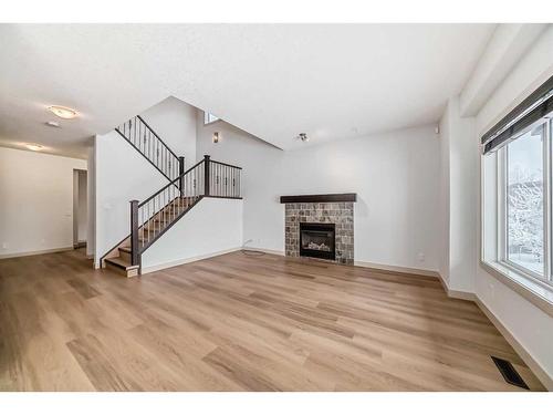 311 Mahogany Court Se, Calgary, AB - Indoor Photo Showing Living Room With Fireplace