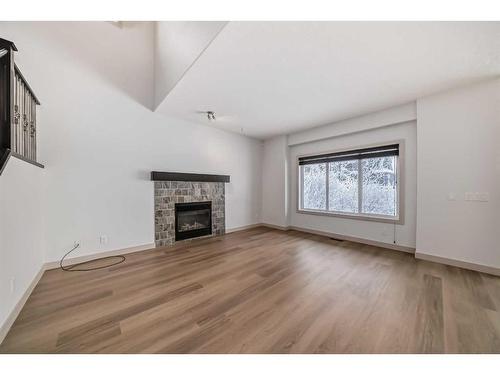 311 Mahogany Court Se, Calgary, AB - Indoor Photo Showing Living Room With Fireplace