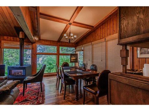 631 East Chestermere Drive, Chestermere, AB - Indoor Photo Showing Dining Room With Fireplace