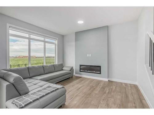 114 Waterford Road, Chestermere, AB - Indoor Photo Showing Living Room With Fireplace