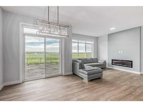 114 Waterford Road, Chestermere, AB - Indoor Photo Showing Living Room With Fireplace