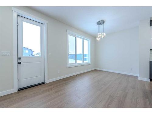 22 North Bridges Landing, Langdon, AB - Indoor Photo Showing Other Room With Fireplace