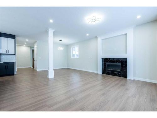 22 North Bridges Landing, Langdon, AB - Indoor Photo Showing Living Room With Fireplace