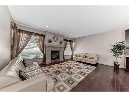 151 Everbrook Drive Sw, Calgary, AB - Indoor Photo Showing Living Room With Fireplace