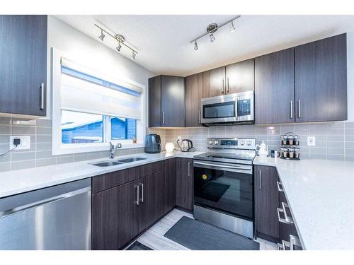 257 Cornerstone Passage Ne, Calgary, AB - Indoor Photo Showing Kitchen With Stainless Steel Kitchen With Double Sink