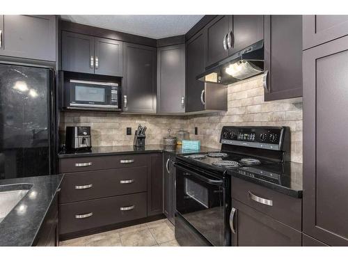 108 Chaparral Valley Gardens Se, Calgary, AB - Indoor Photo Showing Kitchen With Upgraded Kitchen