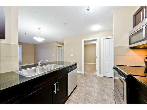 1214-81 Legacy Boulevard Se, Calgary, AB - Indoor Photo Showing Kitchen With Double Sink