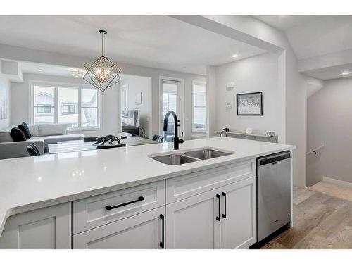 141 Crestridge Common Sw, Calgary, AB - Indoor Photo Showing Kitchen With Double Sink