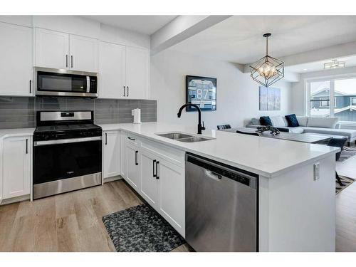 141 Crestridge Common Sw, Calgary, AB - Indoor Photo Showing Kitchen With Double Sink