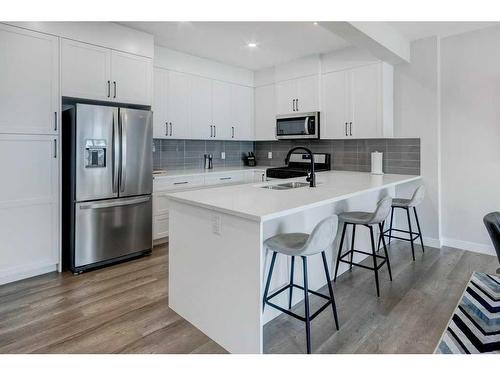 141 Crestridge Common Sw, Calgary, AB - Indoor Photo Showing Kitchen With Stainless Steel Kitchen With Double Sink