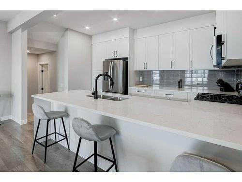 141 Crestridge Common Sw, Calgary, AB - Indoor Photo Showing Kitchen With Double Sink With Upgraded Kitchen