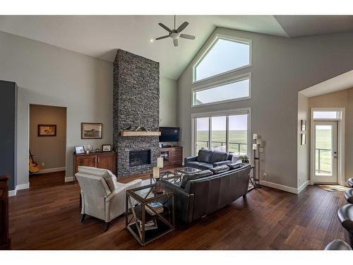 262107 Range Road 11, Balzac, AB - Indoor Photo Showing Living Room With Fireplace