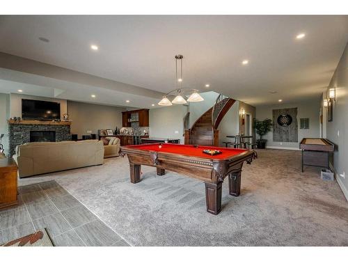 262107 Range Road 11, Balzac, AB - Indoor Photo Showing Other Room With Fireplace