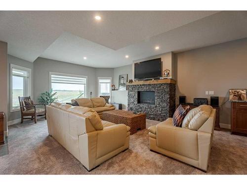 262107 Range Road 11, Balzac, AB - Indoor Photo Showing Living Room With Fireplace