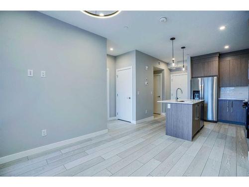 1318-111 Wolf Creek Drive Se, Calgary, AB - Indoor Photo Showing Kitchen With Stainless Steel Kitchen