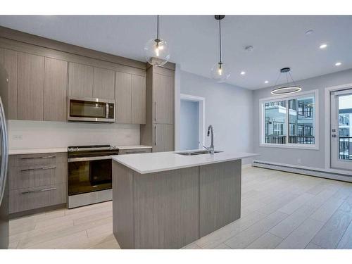 1318-111 Wolf Creek Drive Se, Calgary, AB - Indoor Photo Showing Kitchen With Stainless Steel Kitchen With Upgraded Kitchen