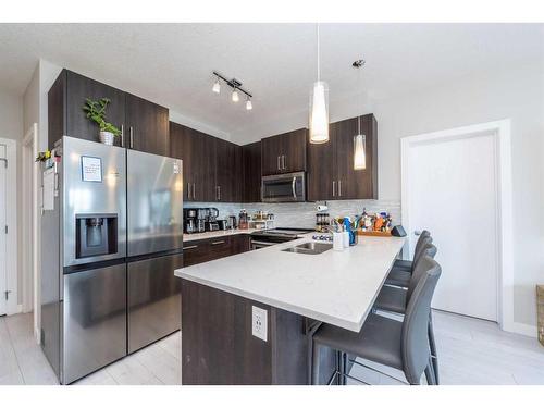 202-24 Sage Hill Terrace Nw, Calgary, AB - Indoor Photo Showing Kitchen With Double Sink With Upgraded Kitchen