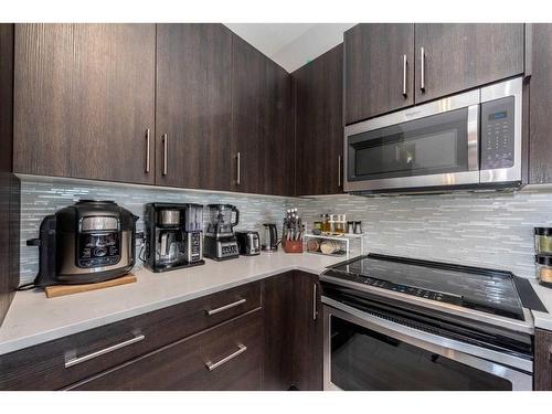 202-24 Sage Hill Terrace Nw, Calgary, AB - Indoor Photo Showing Kitchen With Upgraded Kitchen